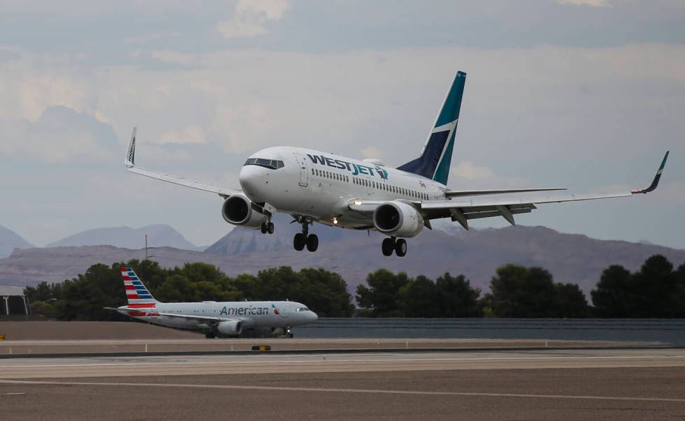 A WestJet plane lands at Harry Reid International Airport on Tuesday, July 26, 2022, in Las Veg ...