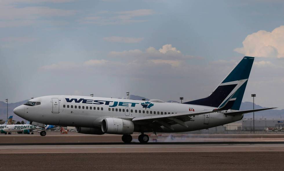 A WestJet plane lands at Harry Reid International Airport on Tuesday, July 26, 2022, in Las Veg ...