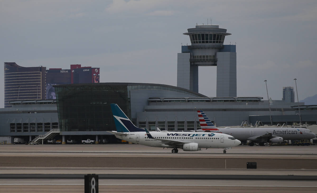 A WestJet plane taxis to a gate at Harry Reid International Airport on Tuesday, July 26, 2022, ...