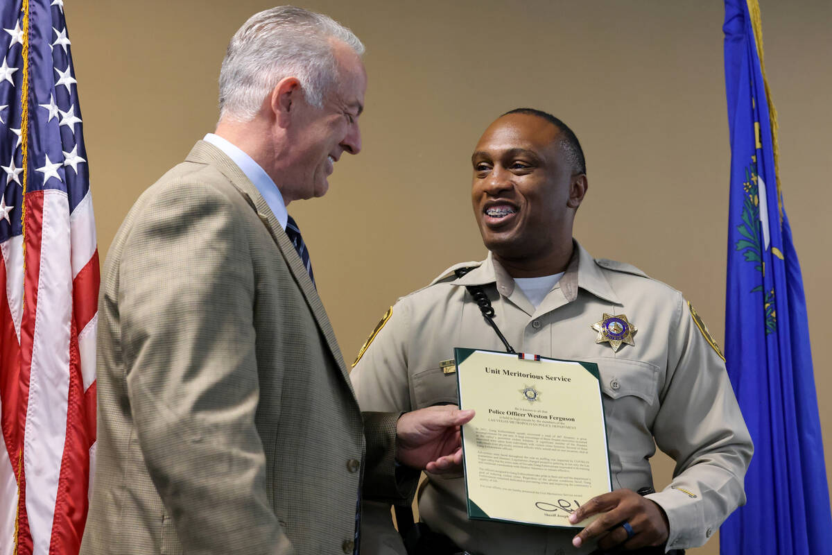 Clark County Sheriff Joe Lombardo presents A Safer Las Vegas award to Detective Weston Ferguson ...