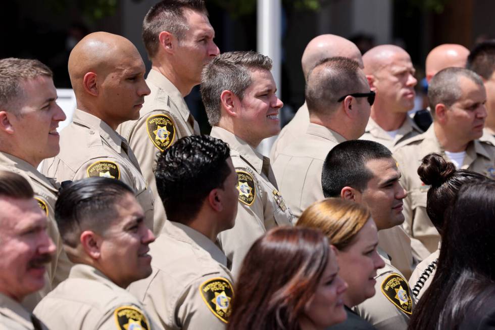 Las Vegas police officers pose for a photo after a commendation ceremony at Metropolitan Police ...