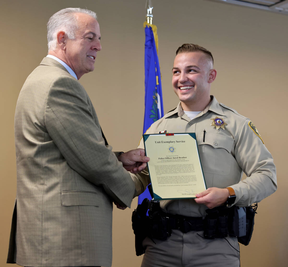 Clark County Sheriff Joe Lombardo presents a Unit Exemplary Service award to Las Vegas police o ...