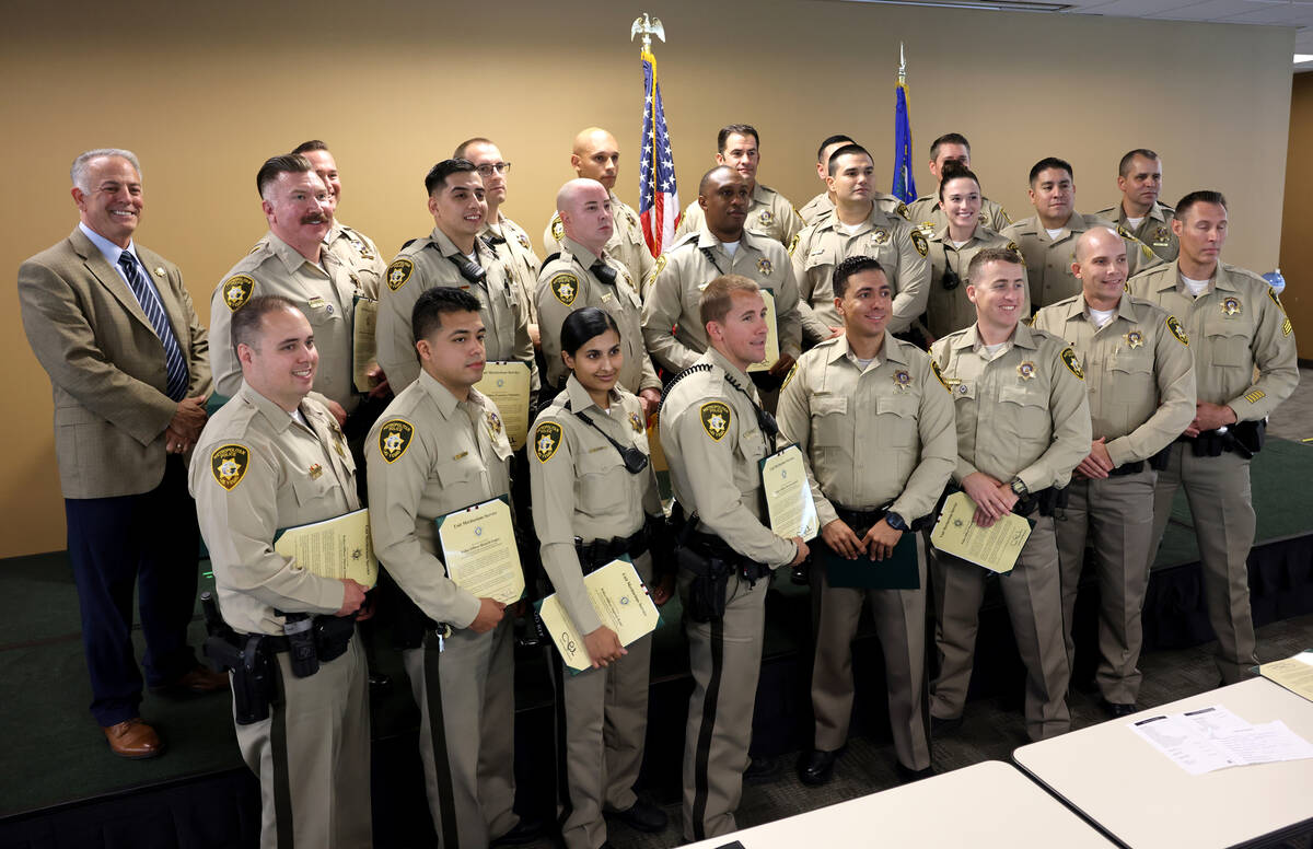Clark County Sheriff Joe Lombardo, left, presents A Safer Las Vegas awards to a unit during a c ...