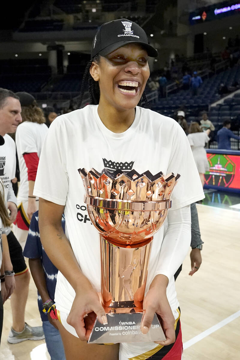 Las Vegas Aces' A'ja Wilson carries the WNBA Commissioner's Cup after the Aces defeated the Chi ...