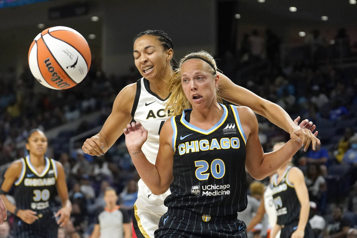 Chicago Sky's Julie Allemand (20) blocks out Las Vegas Aces' Kiah Stokes for the loose ball dur ...