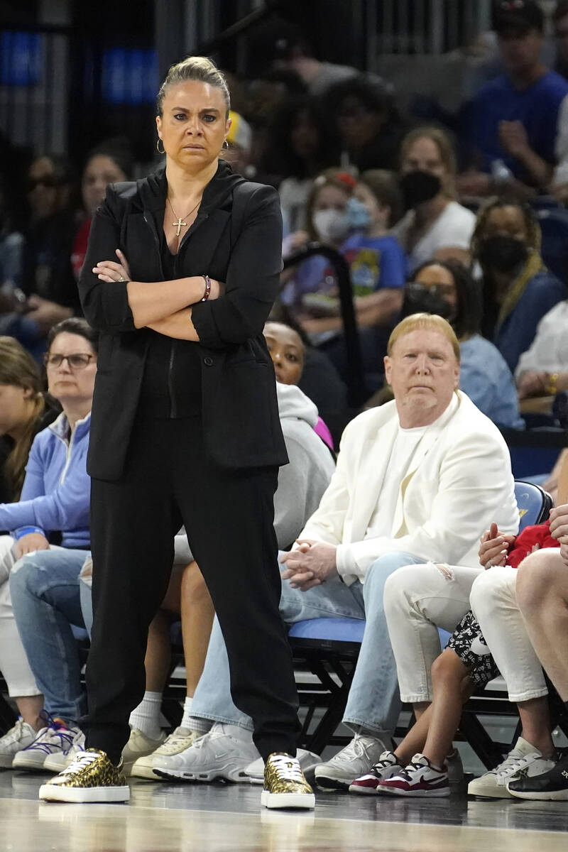 Las Vegas Aces head coach Becky Hammon, left, and team owner Mark Davis watch during the first ...