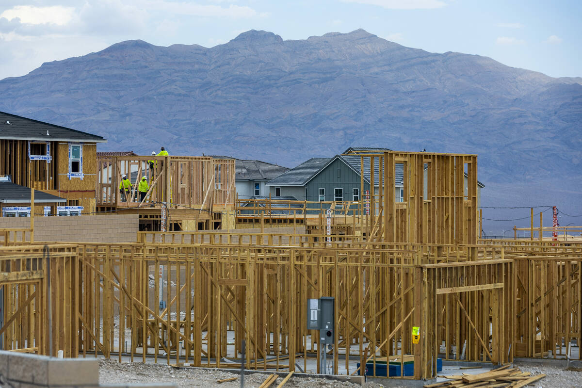 Workers complete framing on new home construction about Skye Canyon on Wednesday, July 27, 2022 ...