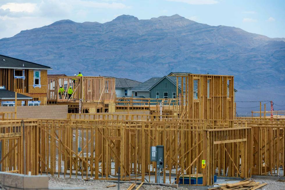 Workers complete framing on new home construction about Skye Canyon on Wednesday, July 27, 2022 ...