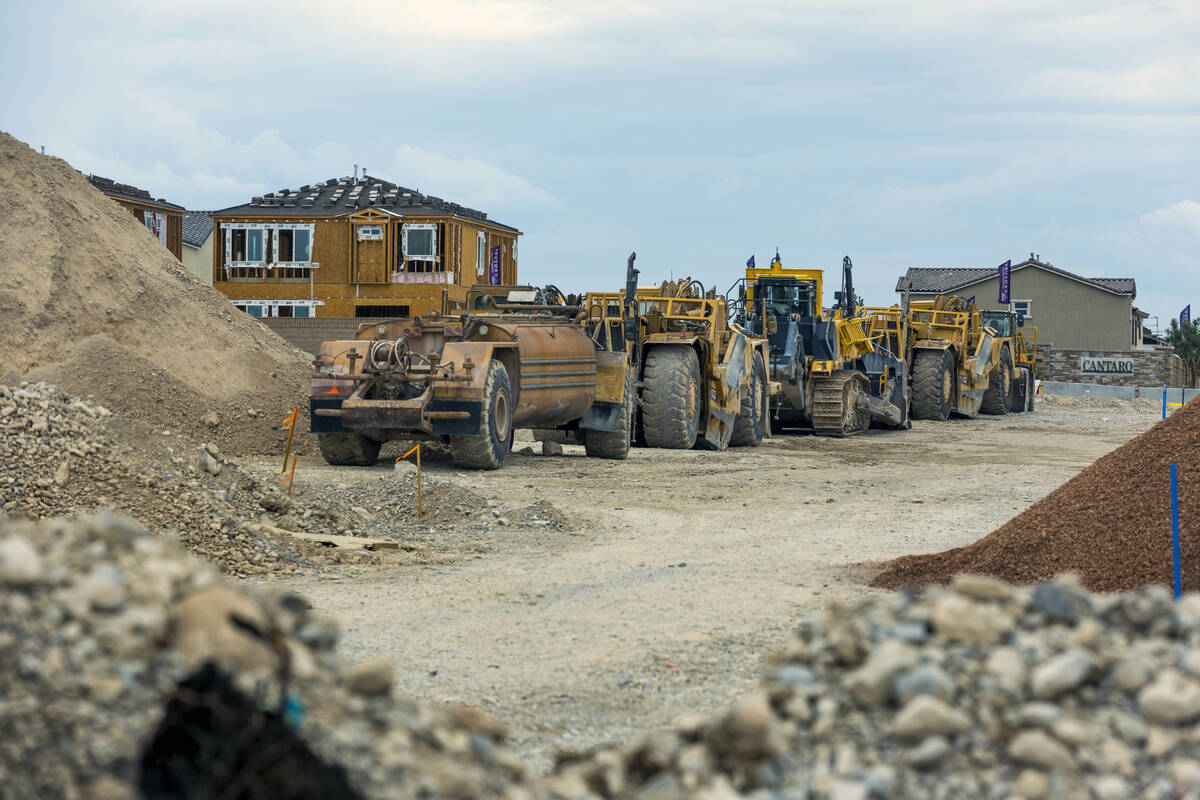 Earth moving equipment is parked at the ready for new home construction about Skye Canyon on We ...