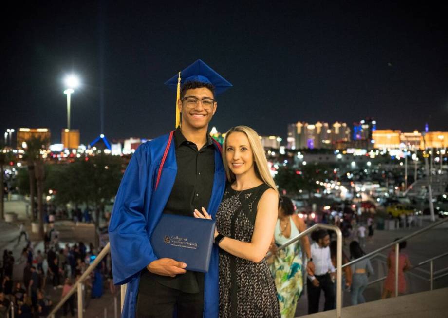 Kelly Paiz, right, Caesars Palace table games supervisor, with her son, Hunter Walker, a recipi ...