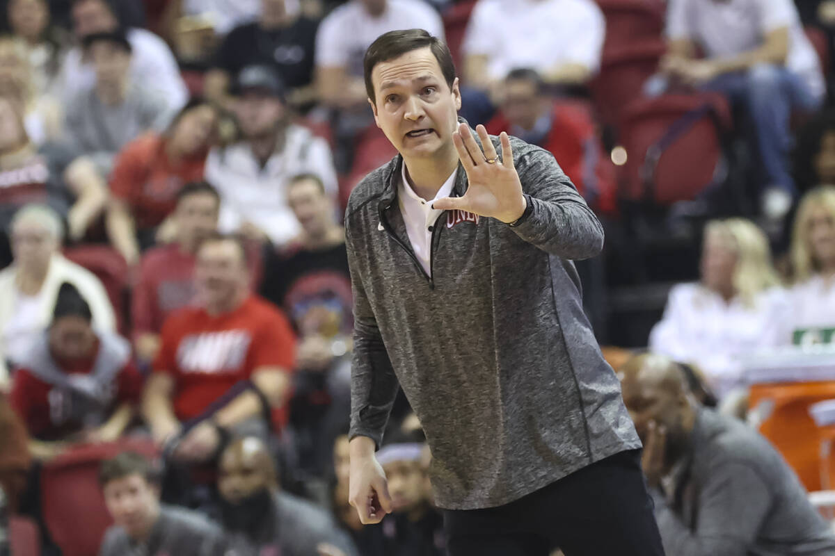 UNLV Rebels head coach Kevin Kruger motions to his team during the first half of a basketball g ...