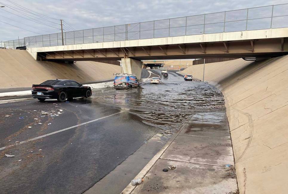 Flooding on westbound Washington Avenue remained on Thursday morning. (Matthew Atencio / Las Ve ...