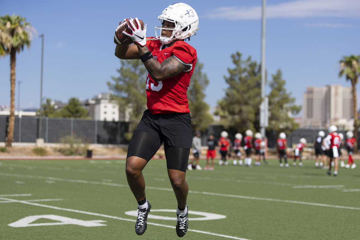 UNLV's Deamikkio Nathan III (13) makes a catch during a team football practice at UNLV in Las V ...