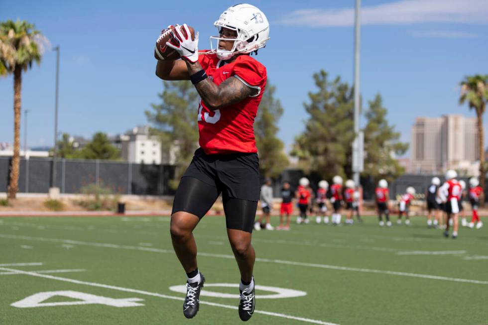 UNLV's Deamikkio Nathan III (13) makes a catch during a team football practice at UNLV in Las V ...