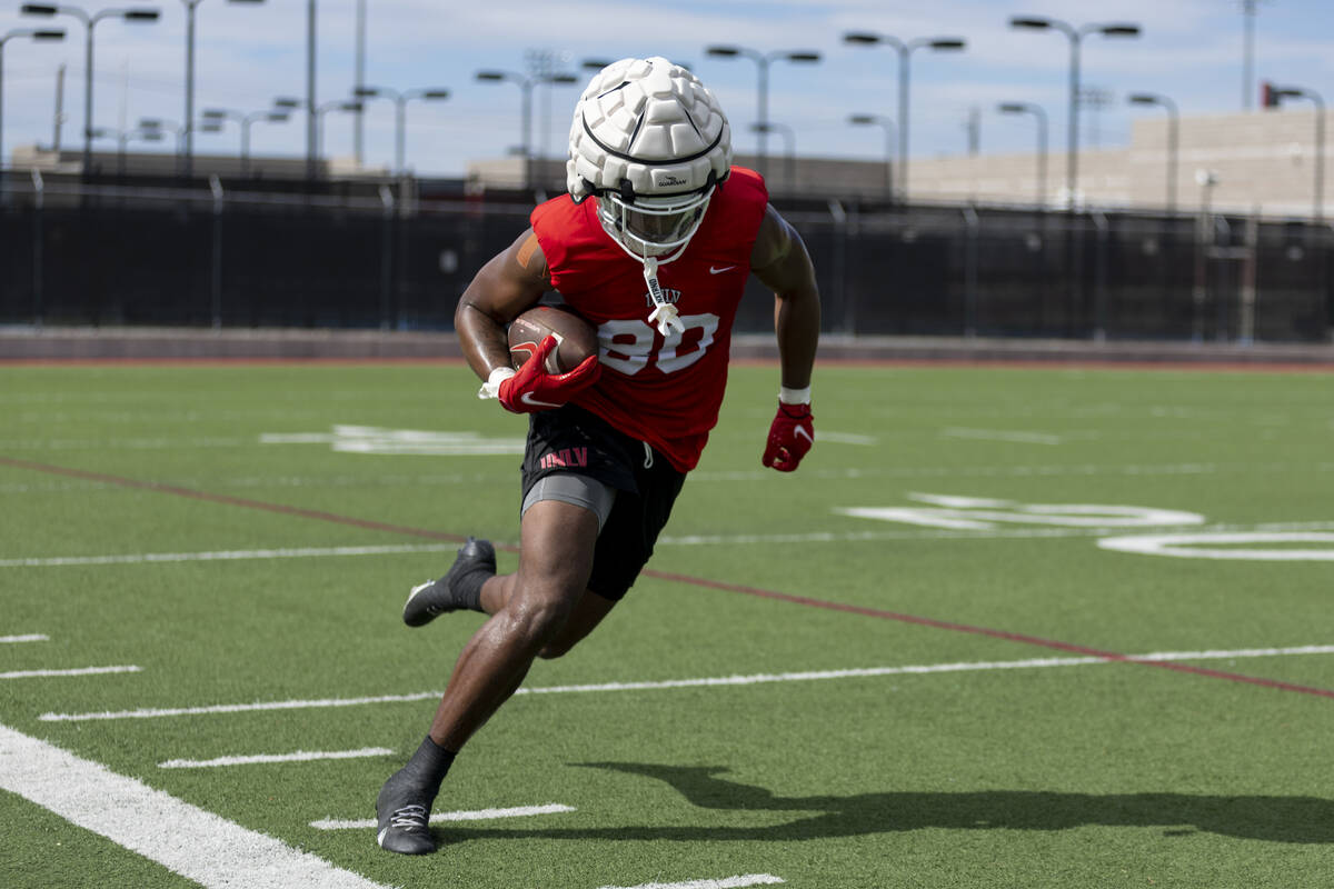 UNLV's Brye Lighon (80) runs the ball after a catch during a team football practice at UNLV in ...