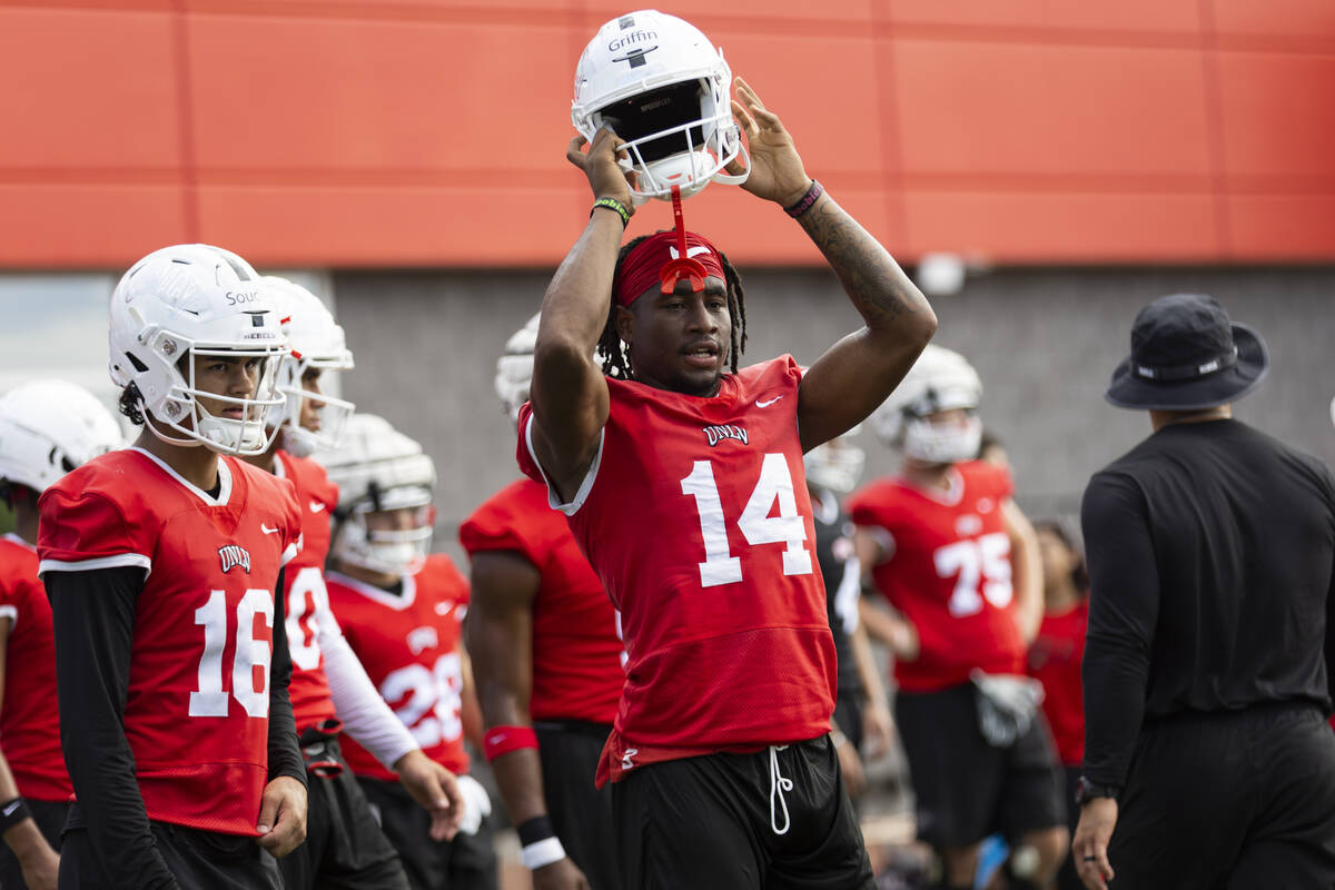 UNLV's Zyell Griffin (14) removes his helmet during a team football practice at UNLV in Las Veg ...
