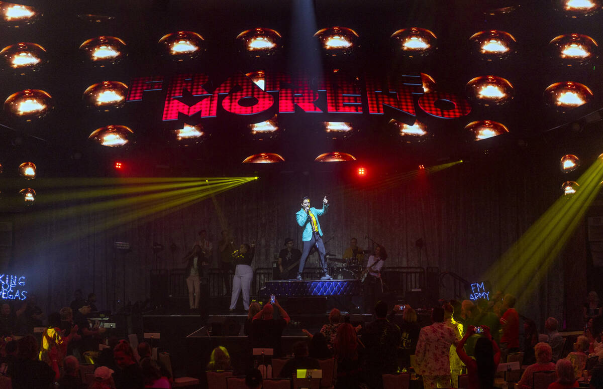 Frankie Moreno sings and dances atop his piano during the opening night performance of his the ...