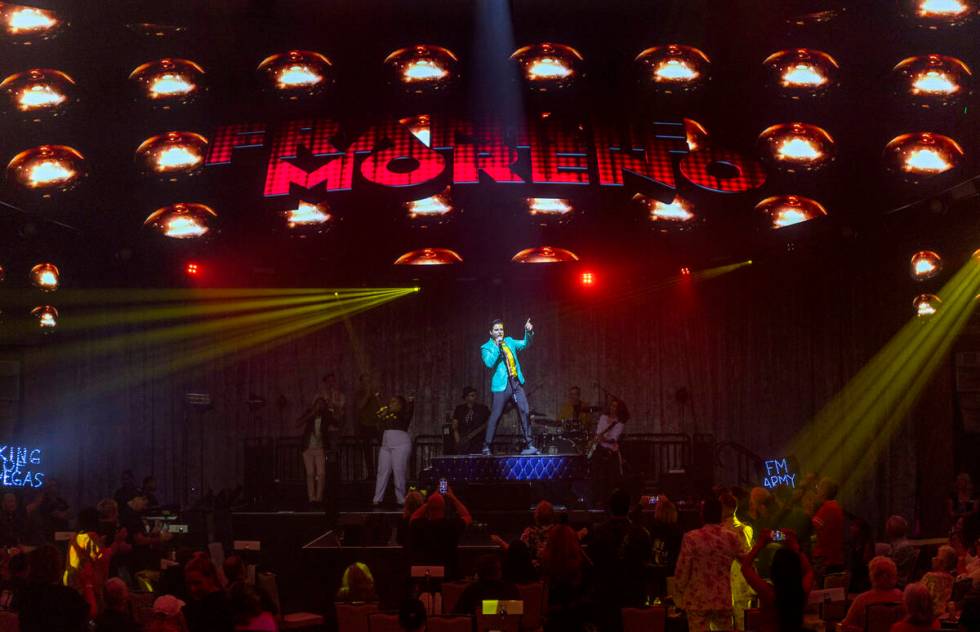 Frankie Moreno sings and dances atop his piano during the opening night performance of his the ...