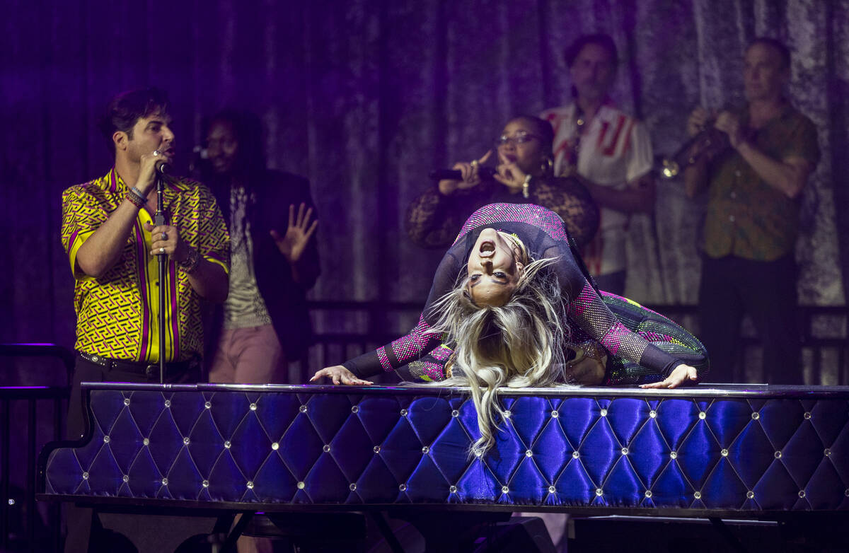 Lacey Schwimmer dances atop the piano as Frankie Moreno sings during the opening night performa ...