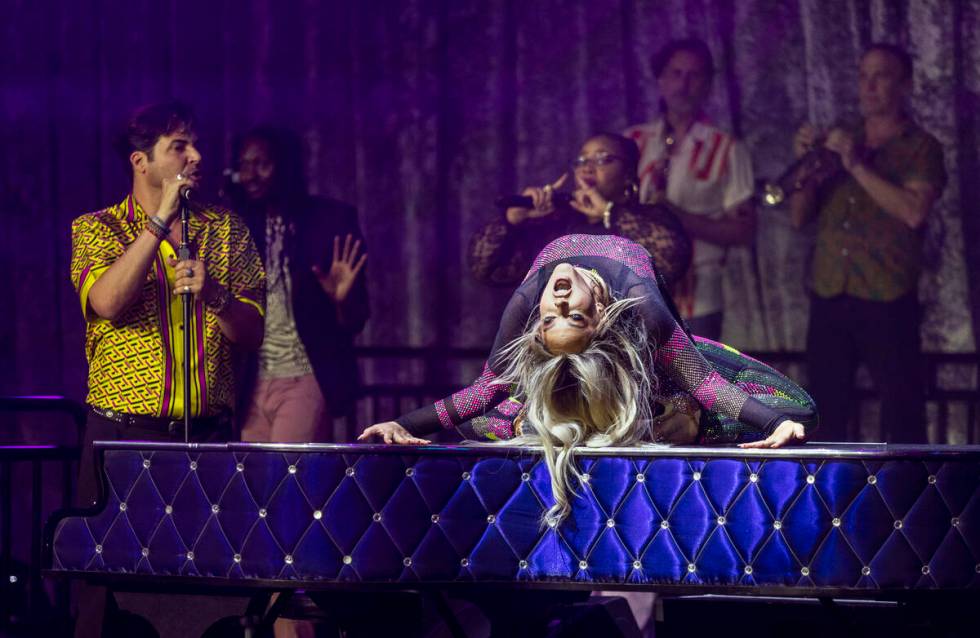 Lacey Schwimmer dances atop the piano as Frankie Moreno sings during the opening night performa ...