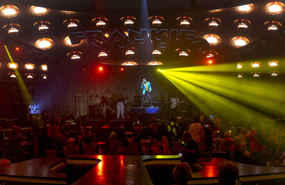 Frankie Moreno sings and dances atop his piano during the opening night performance of his the ...