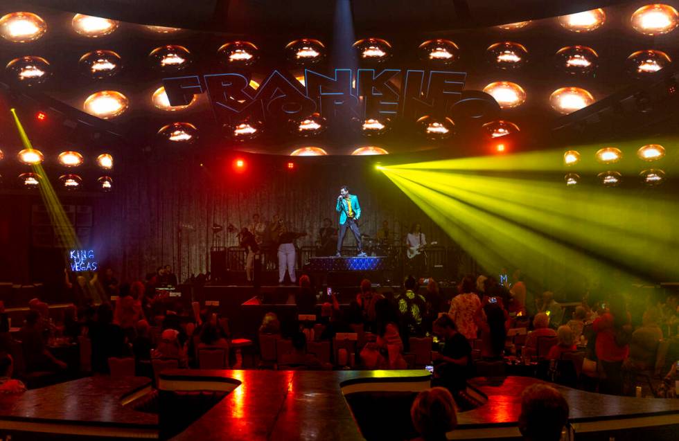 Frankie Moreno sings and dances atop his piano during the opening night performance of his the ...