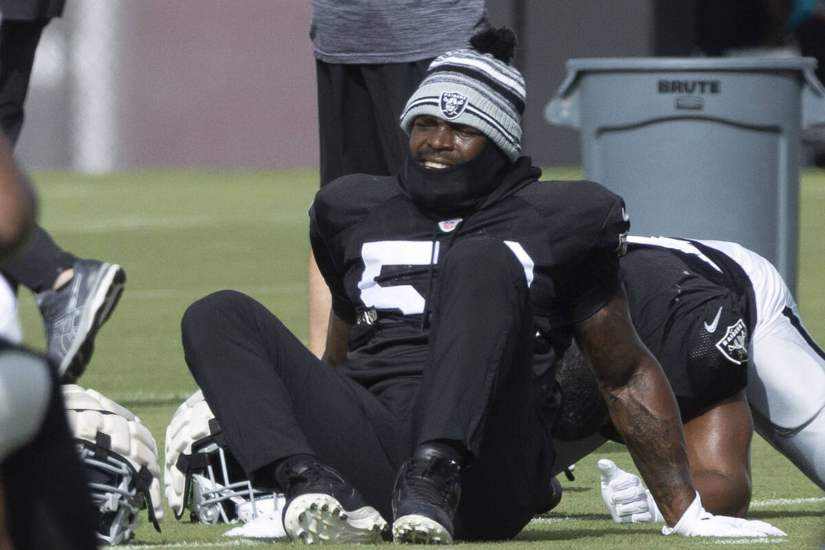 Raiders linebacker Denzel Perryman (52) stretches during the team’s training camp practi ...