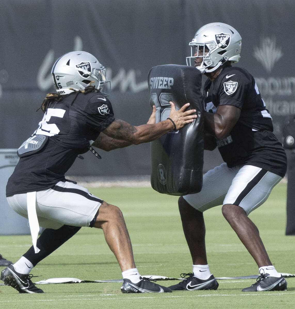 Raiders safety Tre'von Moehrig (25) drills with safety Duron Harmon (30) during the team&#x2019 ...