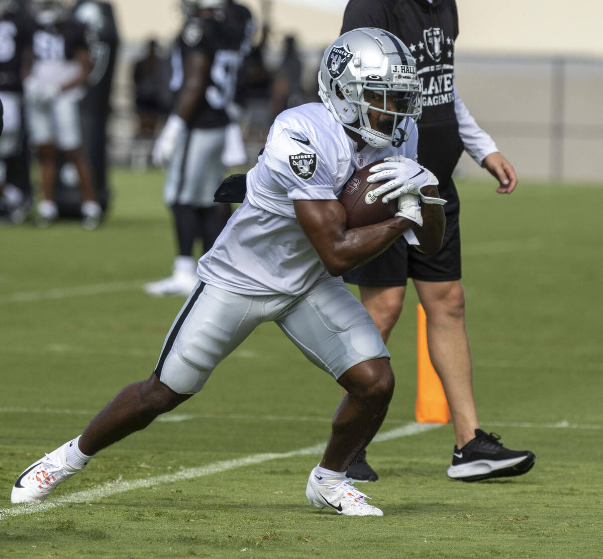 Raiders wide receiver Justin Hall (12) hauls in a catch during the team’s training camp ...