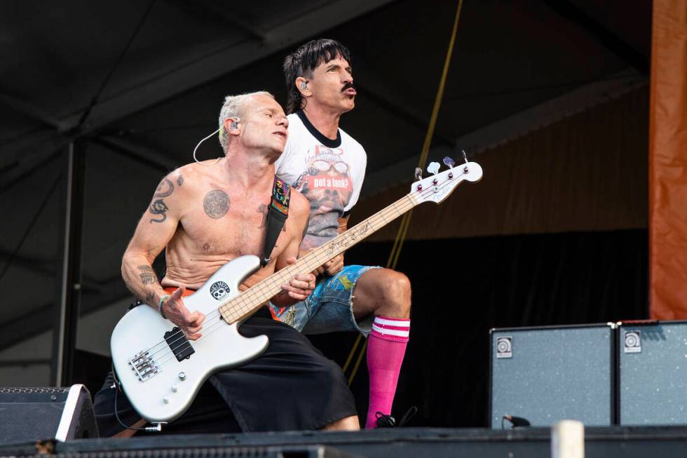 Flea, left, and Anthony Kiedis of the Red Hot Chili Peppers perform at the New Orleans Jazz and ...