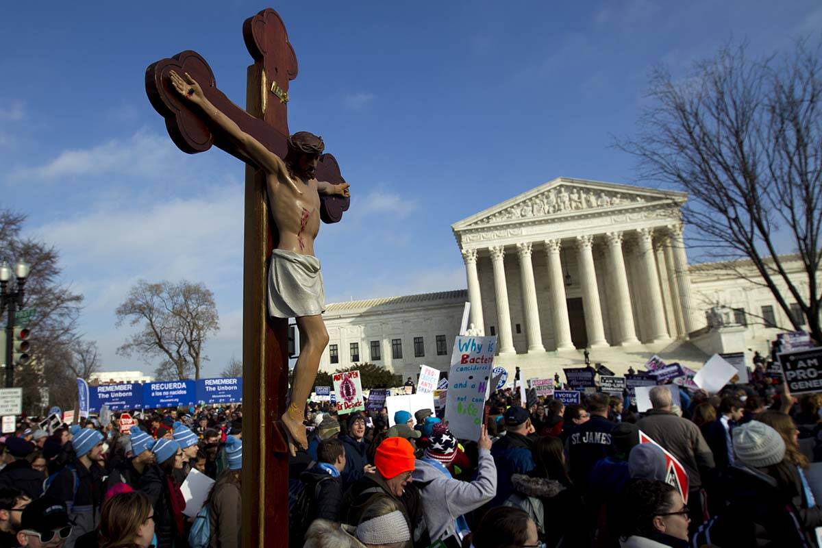 Anti-abortion activists march outside the U.S. Supreme Court building, during the March for Lif ...