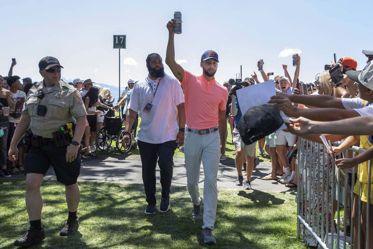 Stephen Curry waves to fans during the first round of the American Century Celebrity Championsh ...