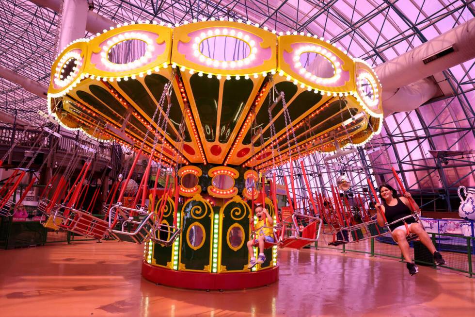 Tyler Bennett, 3, of San Diego and his mom Lady Iberico at a new ride called Circus Swings at C ...