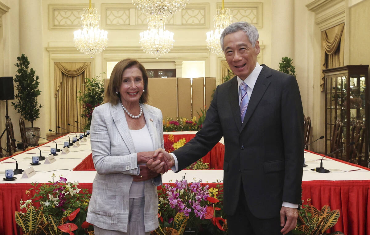 In this photo provided by Ministry of Communications and Information, Singapore, U.S. House Spe ...
