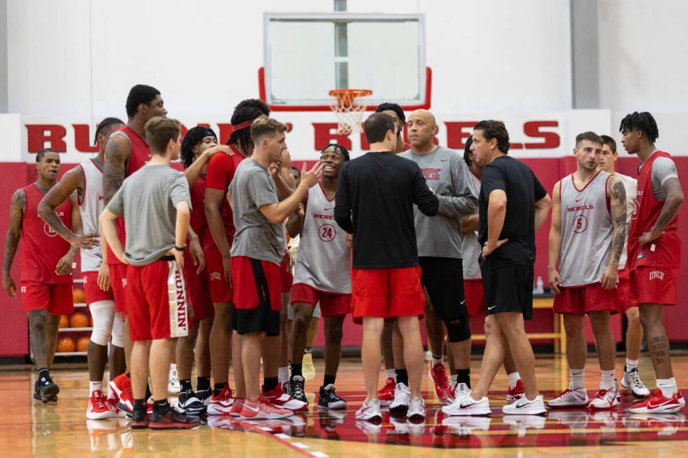 UNLV players huddle with their coaches during a team basketball practice at Mendenhall Center i ...