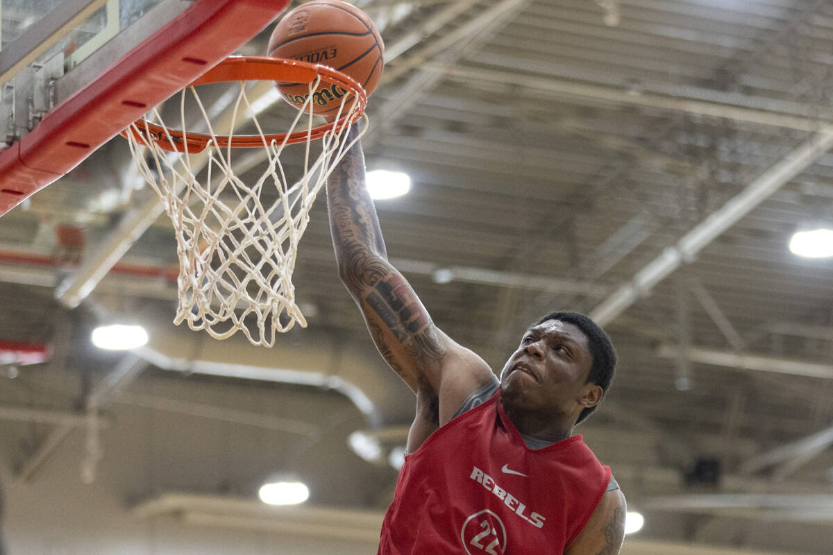 UNLV's Karl Jones (22) goes up for a dunk during a team basketball practice at Mendenhall Cente ...