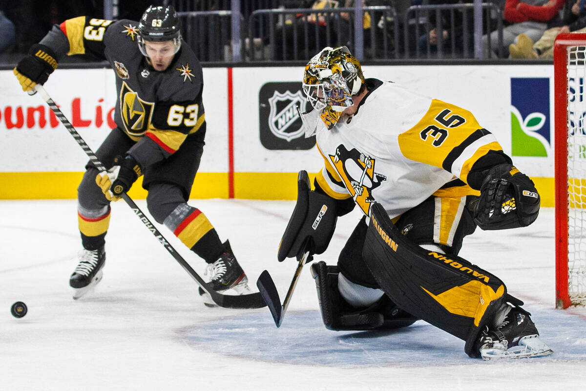 Golden Knights right wing Evgenii Dadonov (63) shoots on Pittsburgh Penguins goaltender Tristan ...