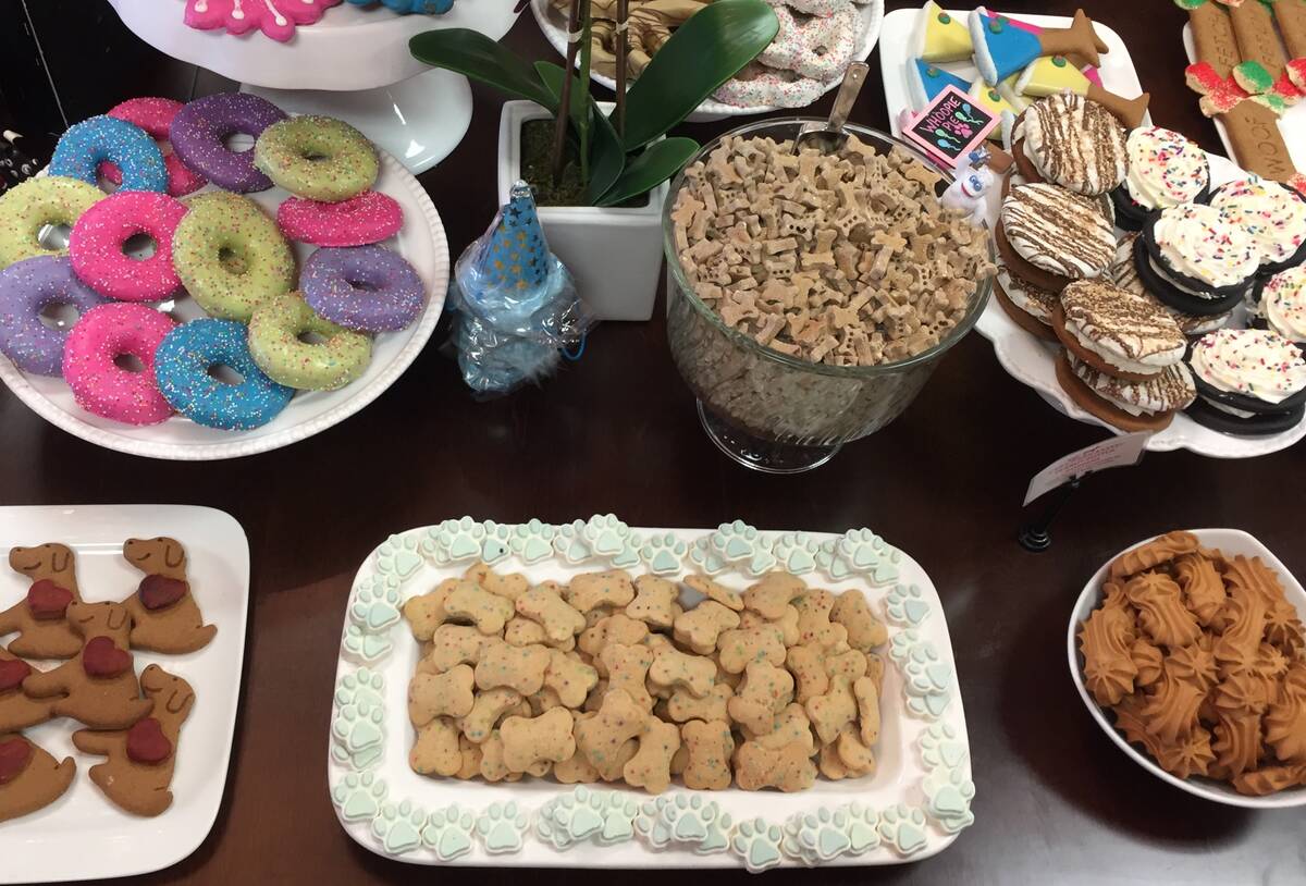 Baked dog treats displayed on a treat table at Woof Gang Bakery & Grooming in Las Vegas on Wedn ...