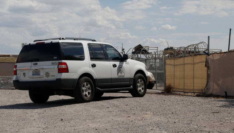 Clark County coroner’s van is parked around the 3000 block of Betty Lane, Tuesday, Aug. ...