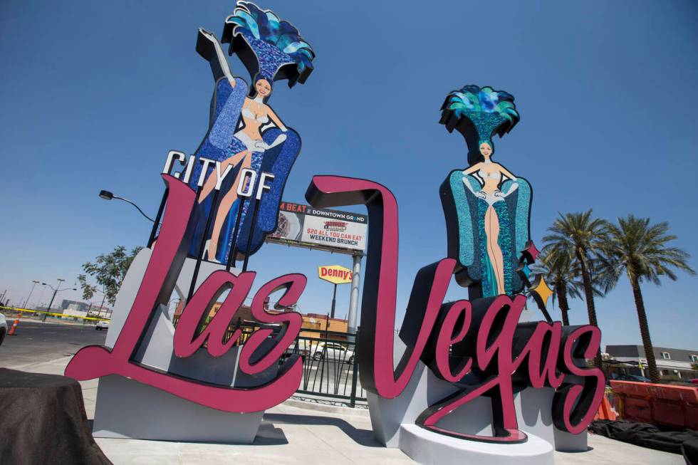 A city of Las Vegas sign, complete with two showgirls and a roulette table, at the corner of La ...
