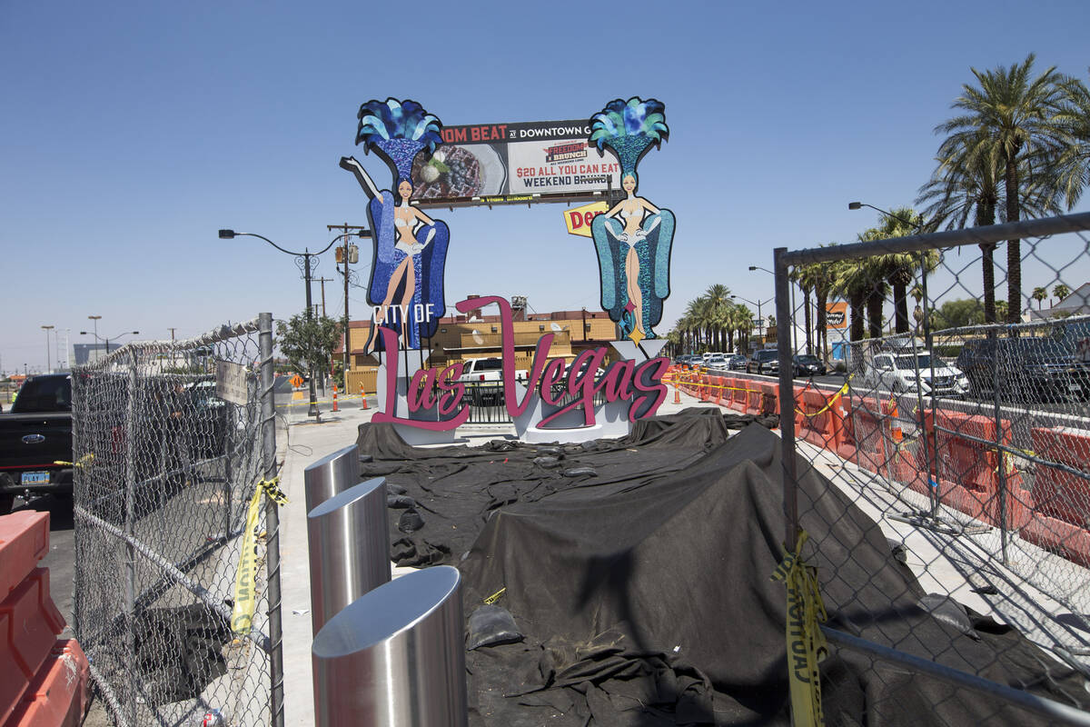A new city of Las Vegas sign, complete with two showgirls and a roulette table, has been built ...