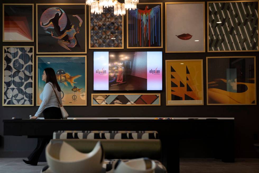 Potential residents check out the space during an opening event at Ely at Fort Apache apartment ...