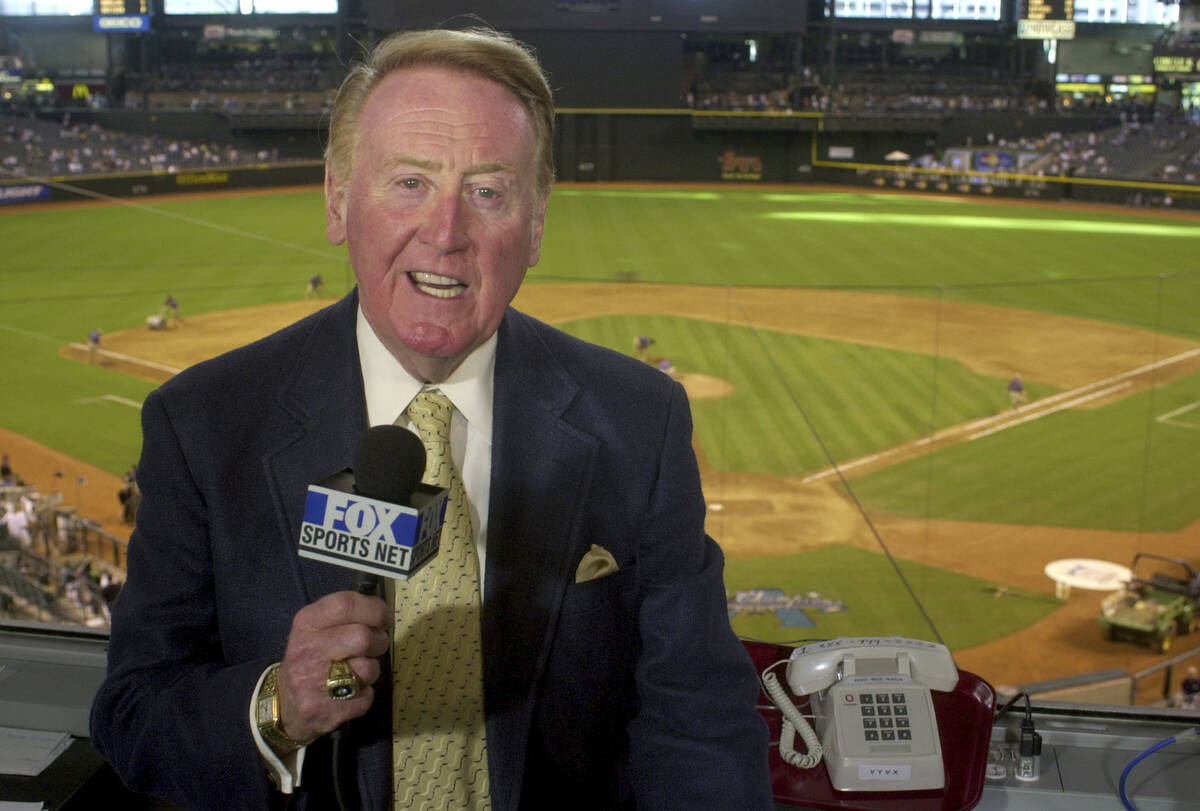 Vin Scully rehearses before a game between the Dodgers and the Arizona Diamondbacks in Phoenix ...