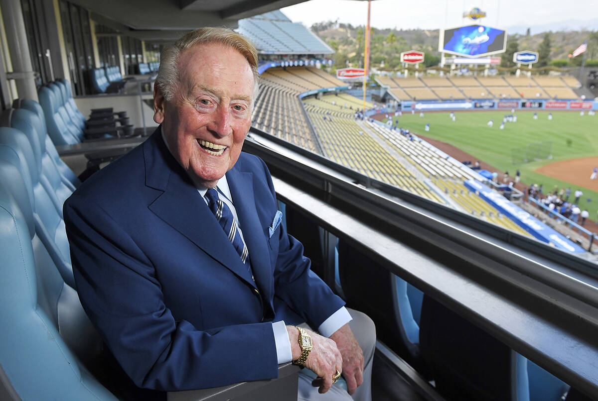 Hall of Fame broadcaster Vin Scully poses for a photo prior to a Dodgers-Giants game in Los Ang ...
