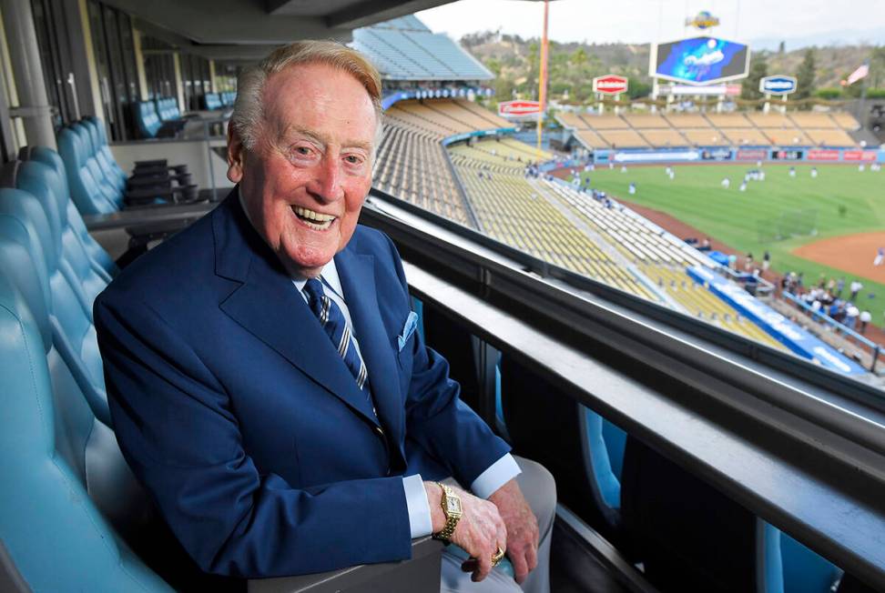 Hall of Fame broadcaster Vin Scully poses for a photo prior to a Dodgers-Giants game in Los Ang ...