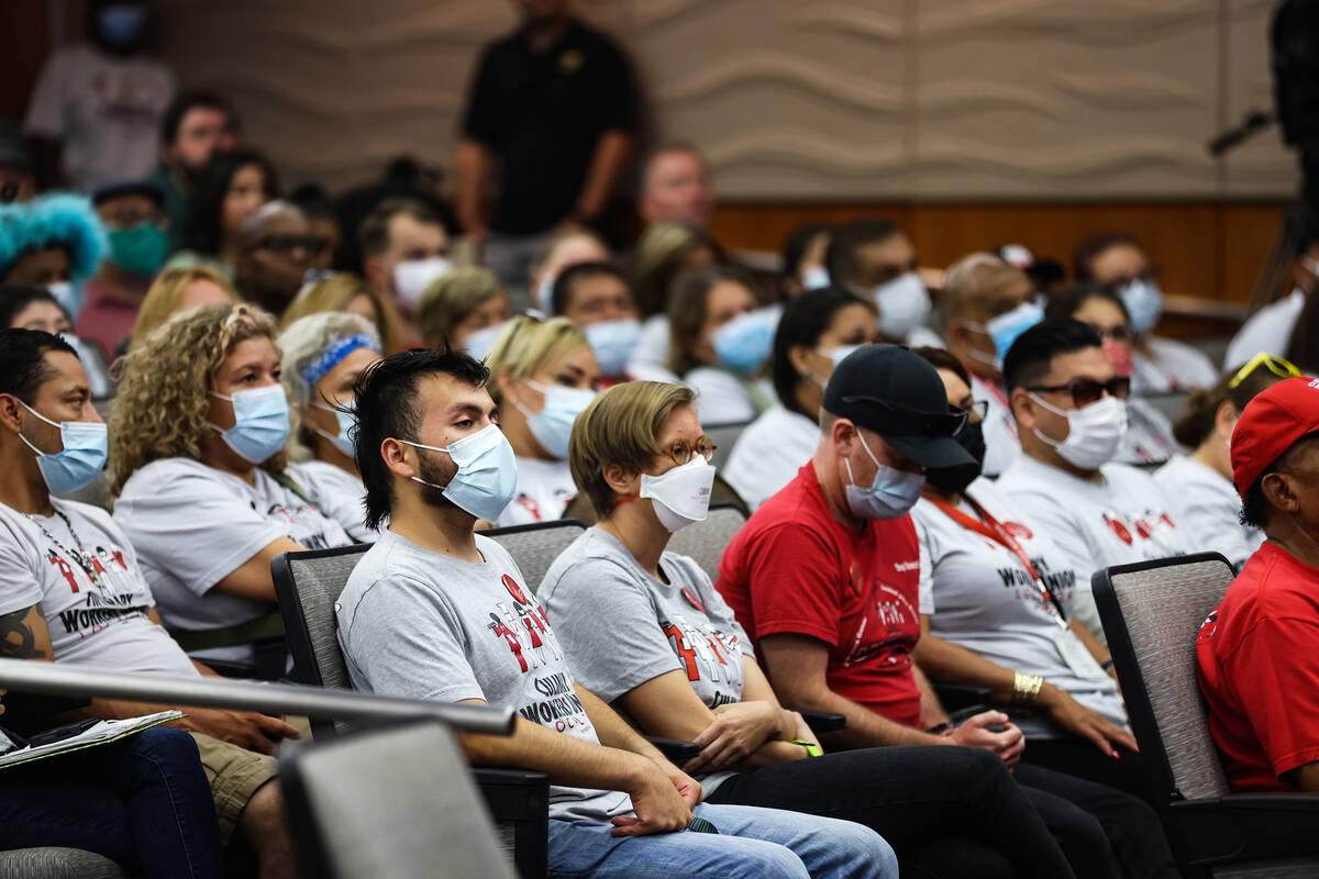Members of the Culinary Union listen during the North Las Vegas City Council meeting at North L ...