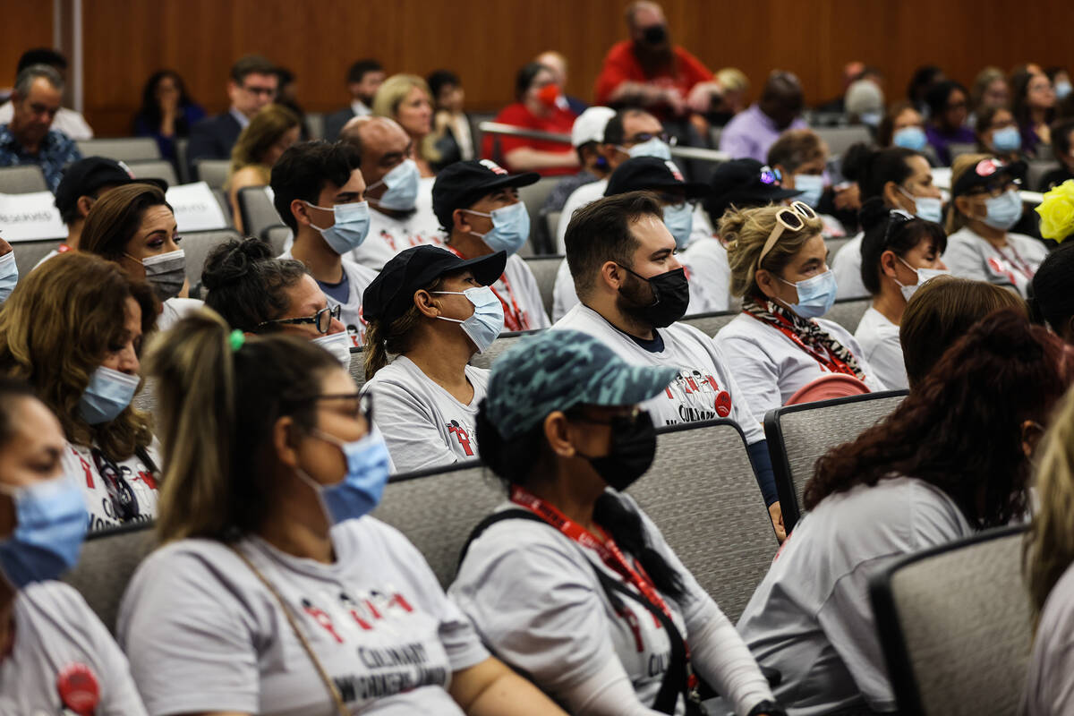 Members of the Culinary Union listen during the North Las Vegas City Council meeting at North L ...