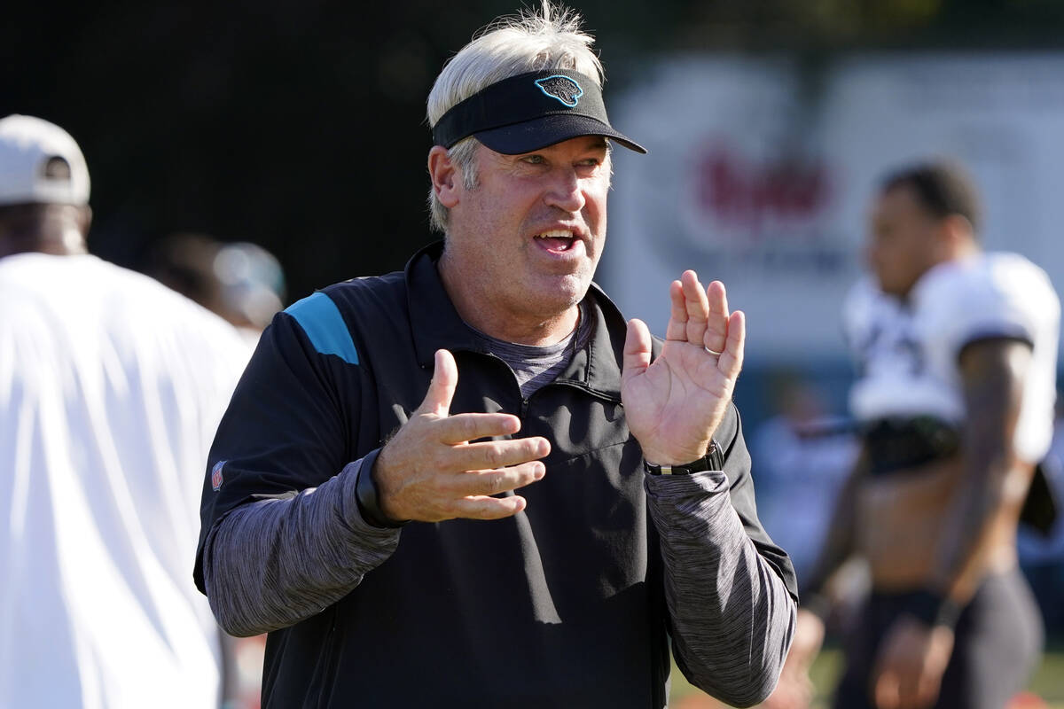 Jacksonville Jaguars head coach Doug Pederson greets players at the start of an NFL football pr ...