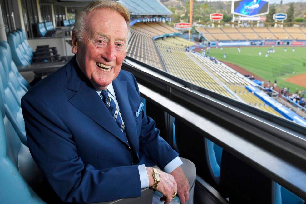 In this Tuesday, Sept. 20, 2016, photo, broadcaster Vin Scully poses for a photo prior a baseba ...