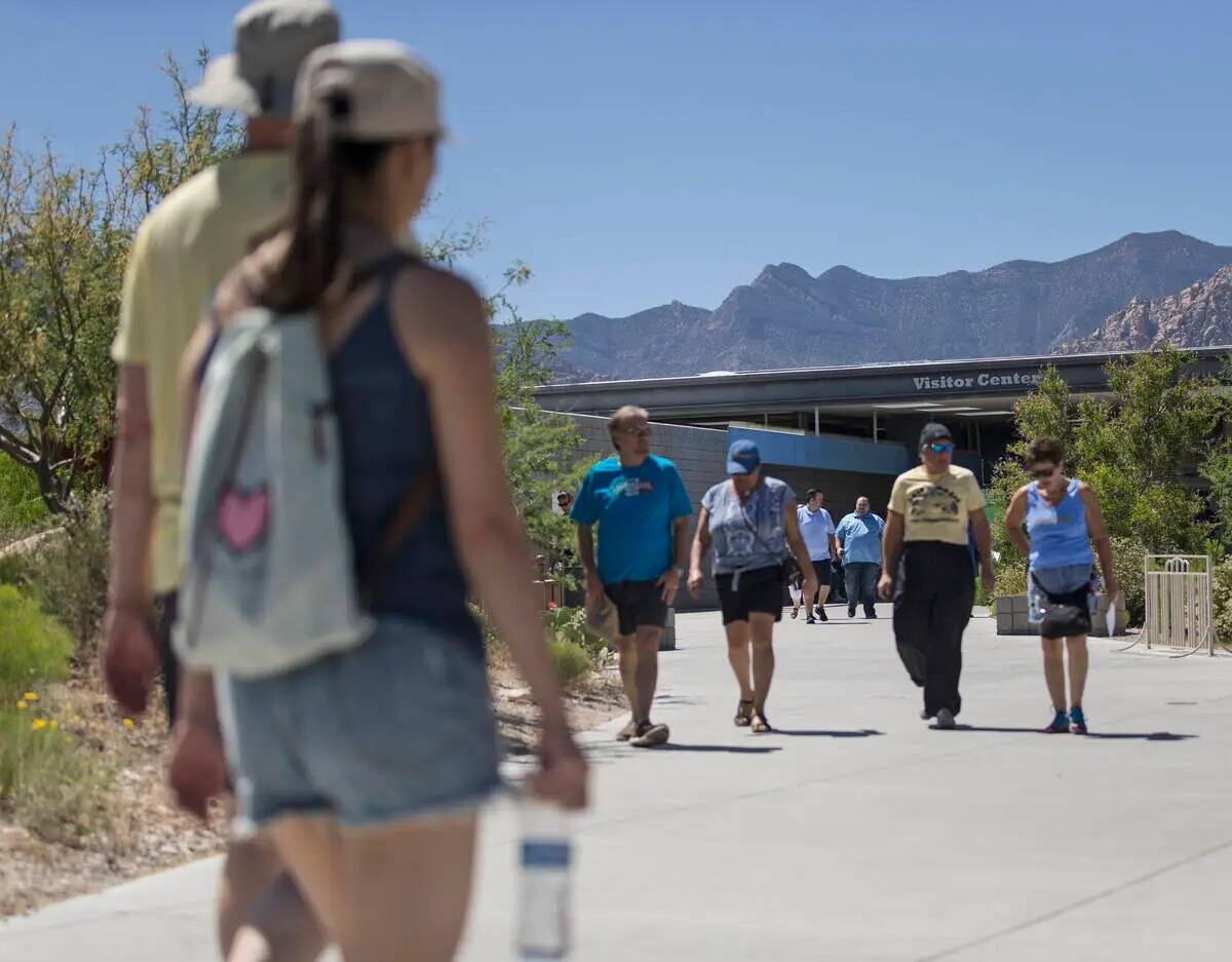 Groups of people come and go at the visitor center during "National Get Outdoors Day" at Red Ro ...